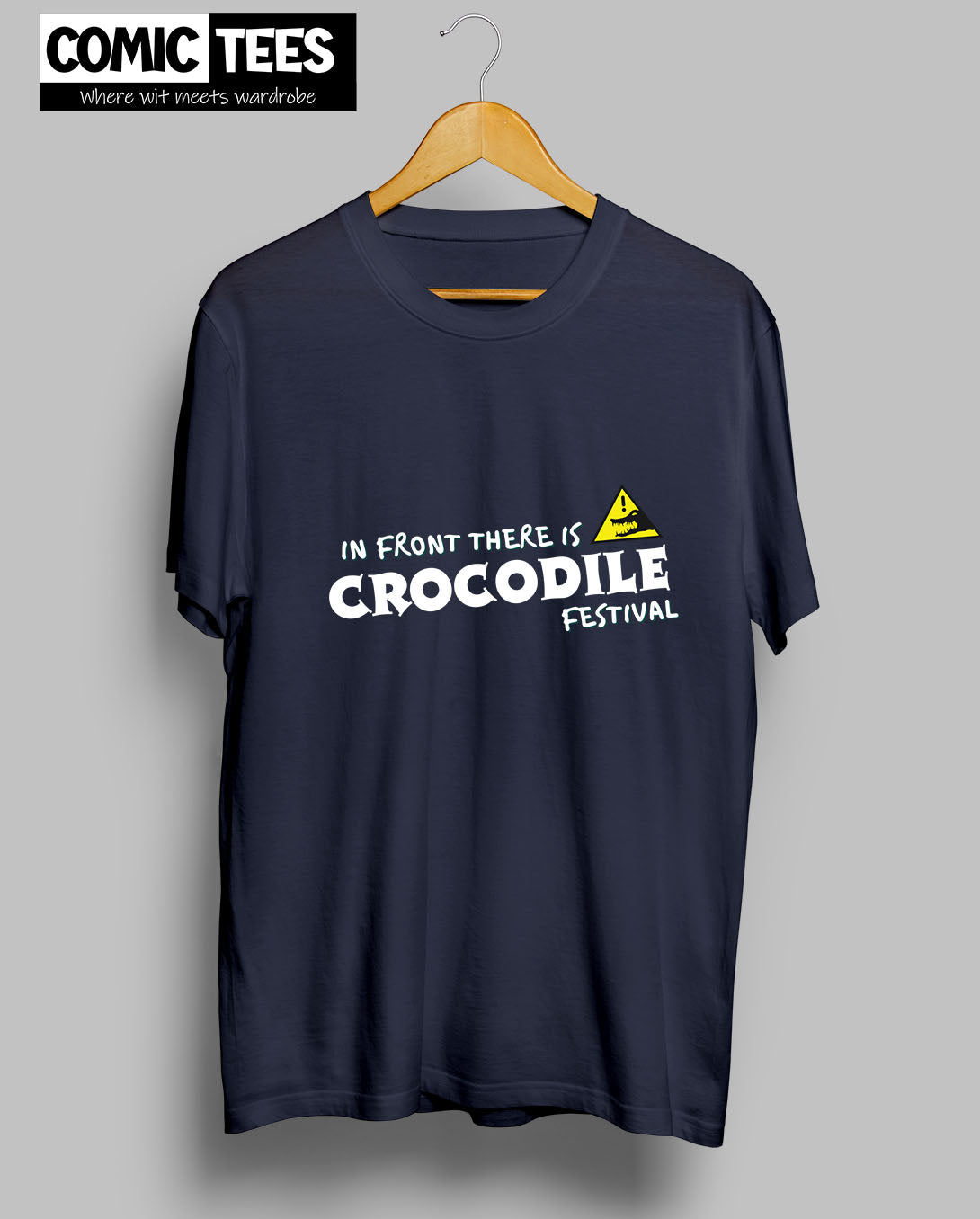 In Front there is a Crocodile Festival T-Shirt