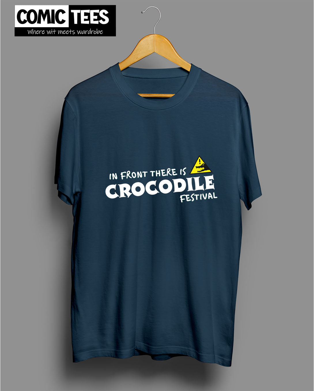 In Front there is a Crocodile Festival T-Shirt