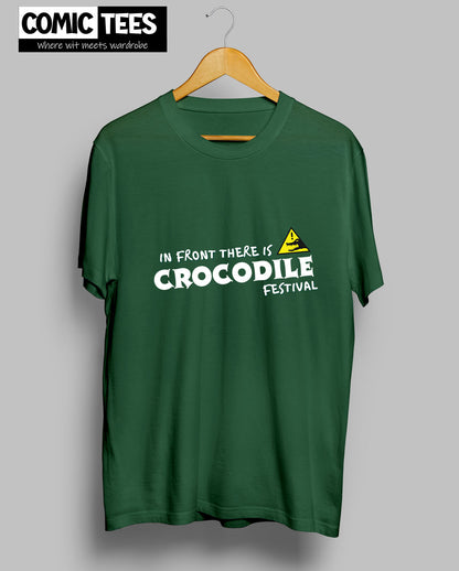 In Front there is a Crocodile Festival T-Shirt